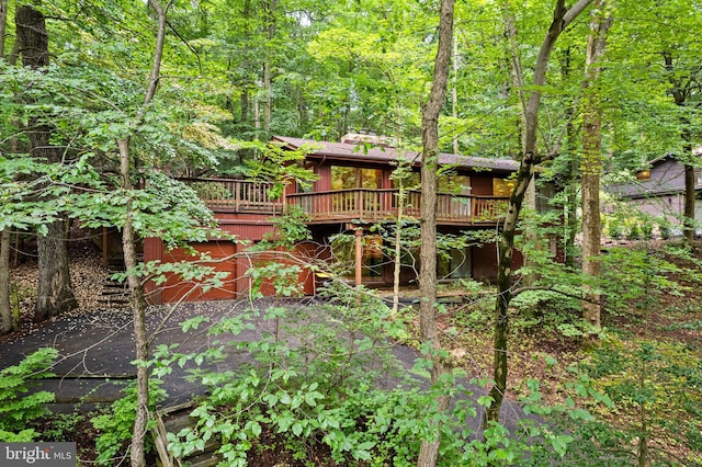 475 Arden, Gulph Mills, PA 19428 - back of house with a deck and a view of trees