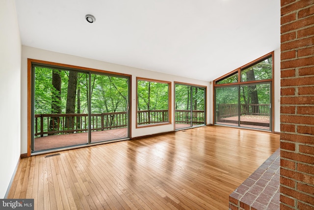 475 Arden, Gulph Mills, PA 19428 - unfurnished living room featuring hardwood / wood-style flooring and vaulted ceiling