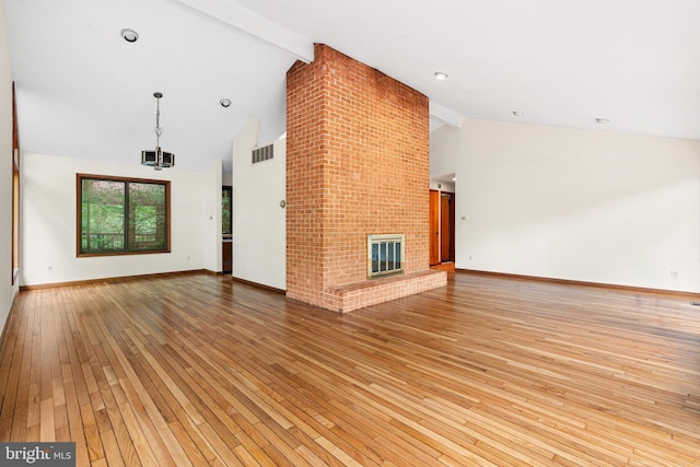 475 Arden, Gulph Mills, PA 19428 - unfurnished living room with light wood finished floors, beam ceiling, high vaulted ceiling, and a fireplace