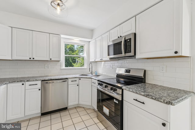 6248 Light Point Pl, Columbia, MD 21045 - kitchen featuring stainless steel appliances, white cabinetry, and tasteful backsplash