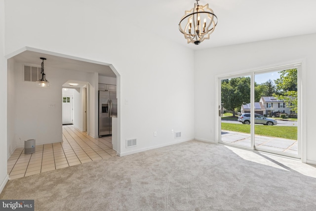 6248 Light Point Pl, Columbia, MD 21045 - tiled empty room featuring arched walkways, carpet floors, and a chandelier