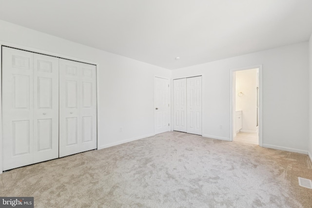 6248 Light Point Pl, Columbia, MD 21045 - unfurnished bedroom with two closets, carpet, and ensuite bathroom