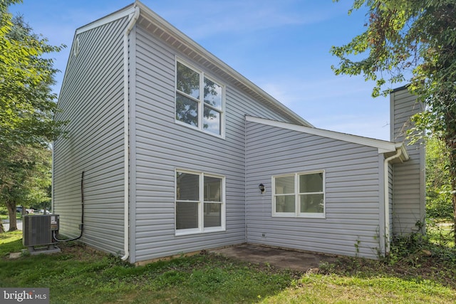 6248 Light Point Pl, Columbia, MD 21045 - back of house featuring a chimney and a patio area