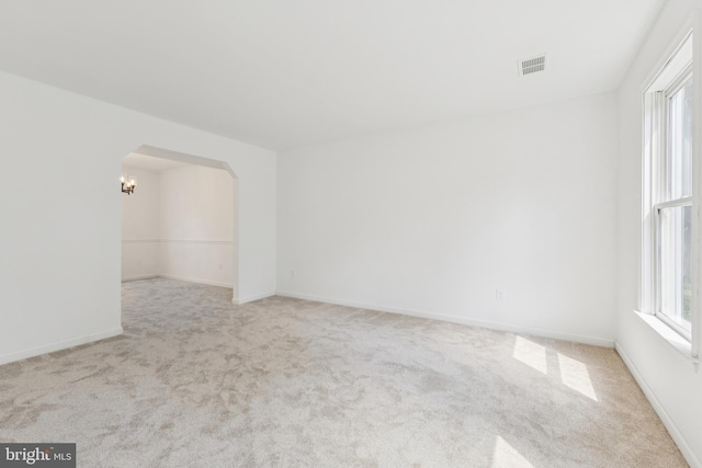 6248 Light Point Pl, Columbia, MD 21045 - carpeted empty room featuring arched walkways and baseboards