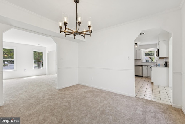 6248 Light Point Pl, Columbia, MD 21045 - spare room with light colored carpet, a chandelier, crown molding, and light tile patterned floors