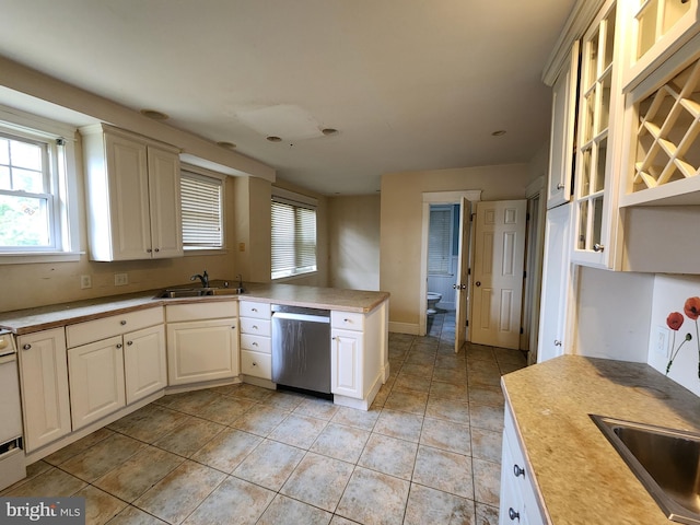 10 Nancy Rd, Wilmington, DE 19809 - kitchen featuring stainless steel dishwasher, a sink, a peninsula, and glass insert cabinets
