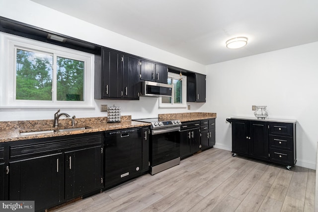 44 Creek Rd, Newville, PA 17241 - kitchen featuring dark cabinetry, stainless steel appliances, a sink, light wood-type flooring, and stone countertops