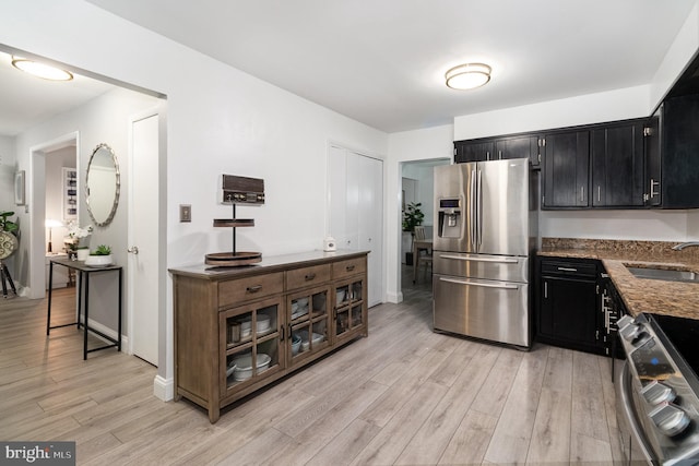 44 Creek Rd, Newville, PA 17241 - kitchen with stainless steel appliances, dark cabinetry, a sink, and light wood finished floors