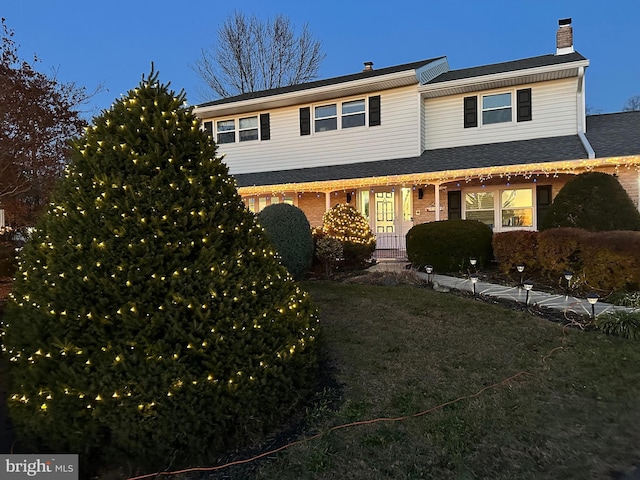 44 Creek Rd, Newville, PA 17241 - view of front of house with a chimney, brick siding, and a front yard