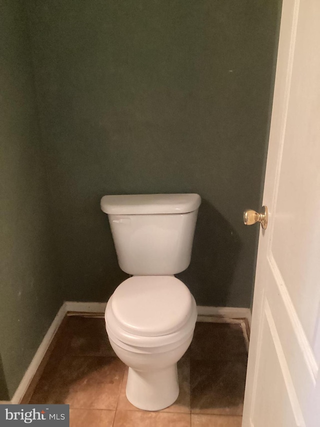 8207 Rison Dr, Brandywine, MD 20613 - bathroom with baseboards, toilet, and tile patterned floors
