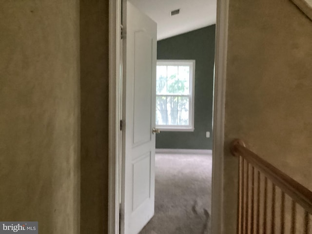8207 Rison Dr, Brandywine, MD 20613 - hallway with radiator heating unit, carpet flooring, and vaulted ceiling