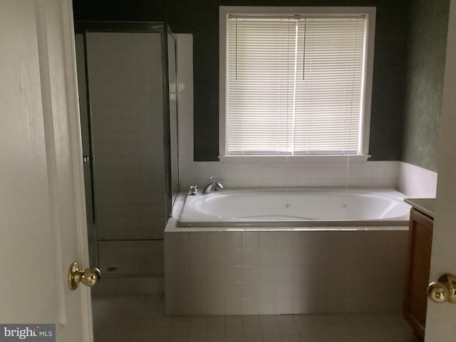 8207 Rison Dr, Brandywine, MD 20613 - bathroom featuring a shower stall, tile patterned flooring, and a garden tub
