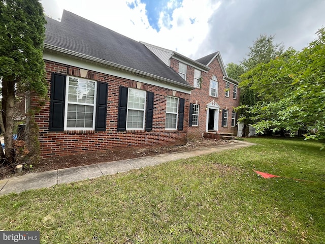 8207 Rison Dr, Brandywine, MD 20613 - view of side of property featuring brick siding, a yard, and roof with shingles
