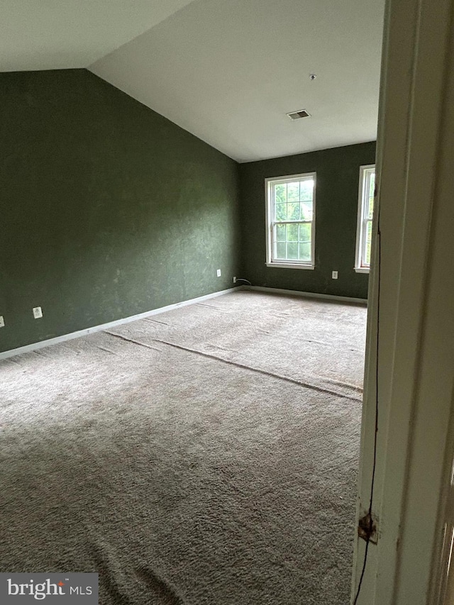 8207 Rison Dr, Brandywine, MD 20613 - carpeted empty room with lofted ceiling and baseboards