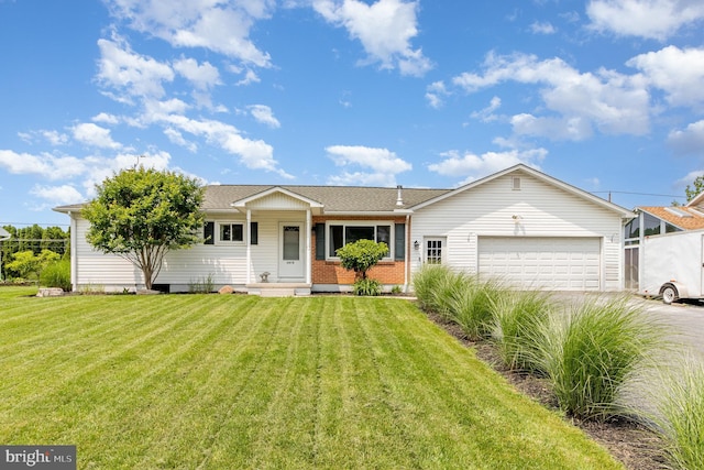 1503 Shirley Ave, Carlisle, PA 17013 - ranch-style house featuring a garage, concrete driveway, a front yard, and brick siding