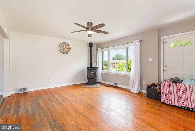 1503 Shirley Ave, Carlisle, PA 17013 - entryway with a wood stove, ceiling fan, wood finished floors, and baseboards