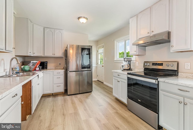 1503 Shirley Ave, Carlisle, PA 17013 - kitchen featuring stainless steel appliances, under cabinet range hood, light wood-style floors, white cabinets, and a sink