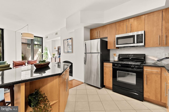 1021 N Garfield St Unit B37, Arlington, VA 22201 - kitchen with appliances with stainless steel finishes, tasteful backsplash, brown cabinets, open floor plan, and light tile patterned flooring