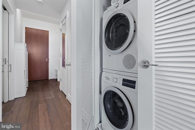 810 O St NW Unit 504, Washington, DC 20001 - washroom with estacked washer and dryer and dark wood-type flooring