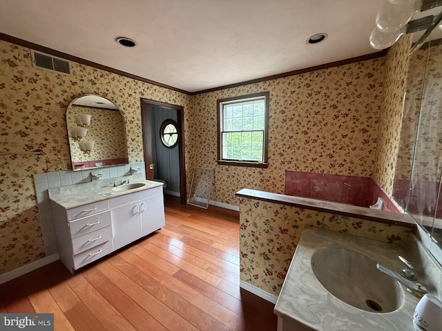 790 Hopewell Rd, Downingtown, PA 19335 - full bath with wallpapered walls, vanity, hardwood / wood-style flooring, ornamental molding, and baseboards