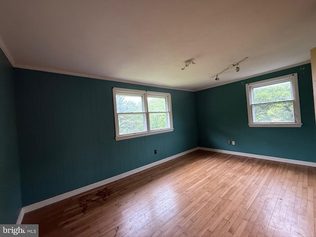 790 Hopewell Rd, Downingtown, PA 19335 - unfurnished room with track lighting, wood-type flooring, baseboards, and wooden walls