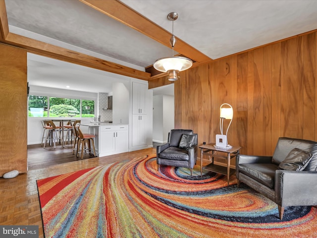 927 Thompson Ave, Jonestown, PA 17038 - living area featuring wood walls and beam ceiling