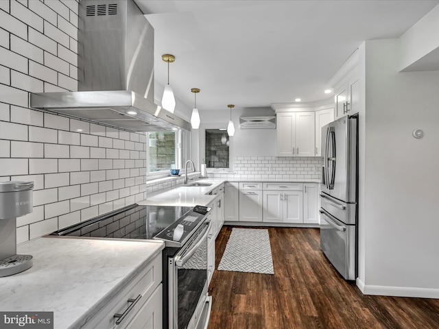 927 Thompson Ave, Jonestown, PA 17038 - kitchen with appliances with stainless steel finishes, wall chimney exhaust hood, tasteful backsplash, white cabinets, and dark wood finished floors