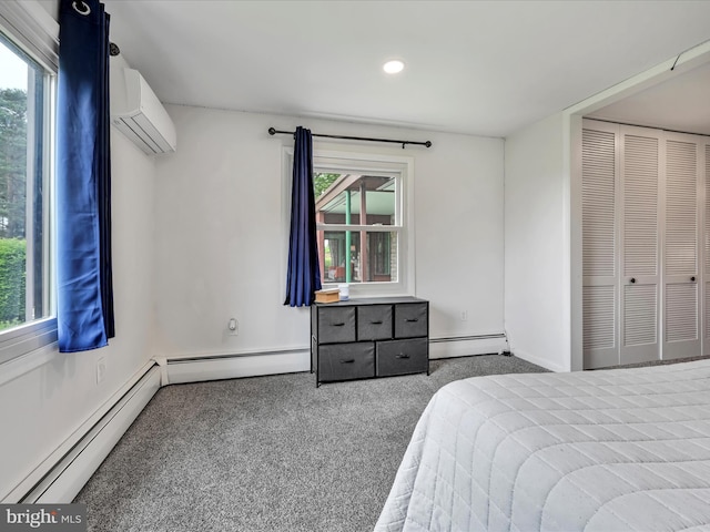 927 Thompson Ave, Jonestown, PA 17038 - bedroom featuring a baseboard radiator, a wall unit AC, carpet, and recessed lighting
