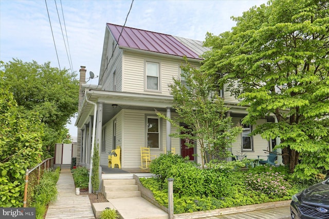 1311 Church St, Lititz, PA 17543 - view of front facade featuring covered porch, a standing seam roof, and metal roof