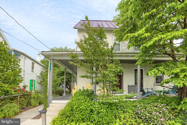 1311 Church St, Lititz, PA 17543 - view of front of house featuring a porch, metal roof, and a standing seam roof