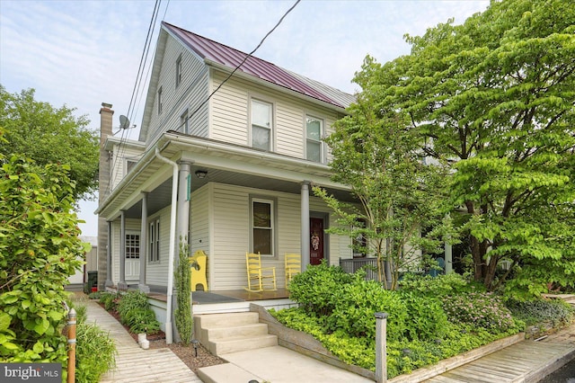 1311 Church St, Lititz, PA 17543 - view of front of home with covered porch, metal roof, and a standing seam roof