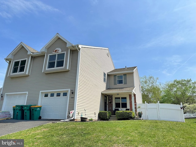 584 Meadow Ln, Pennsburg, PA 18073 - traditional-style house with an attached garage and asphalt driveway
