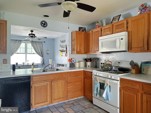 584 Meadow Ln, Pennsburg, PA 18073 - kitchen with white appliances, ceiling fan, a sink, light countertops, and brown cabinetry