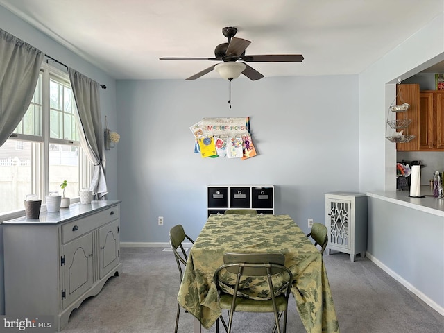 584 Meadow Ln, Pennsburg, PA 18073 - dining area with light colored carpet, a ceiling fan, and baseboards