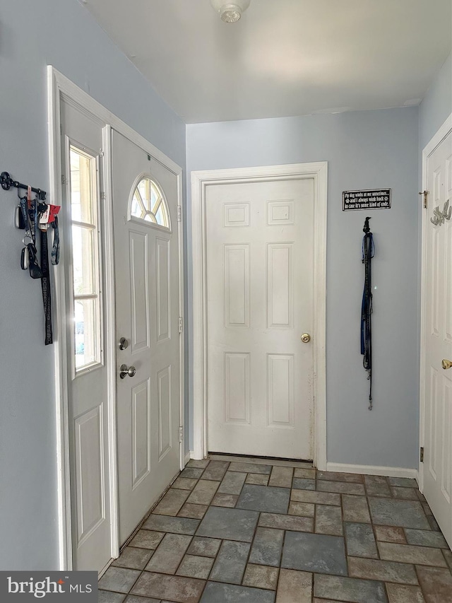 584 Meadow Ln, Pennsburg, PA 18073 - entryway featuring brick patterned flooring and baseboards