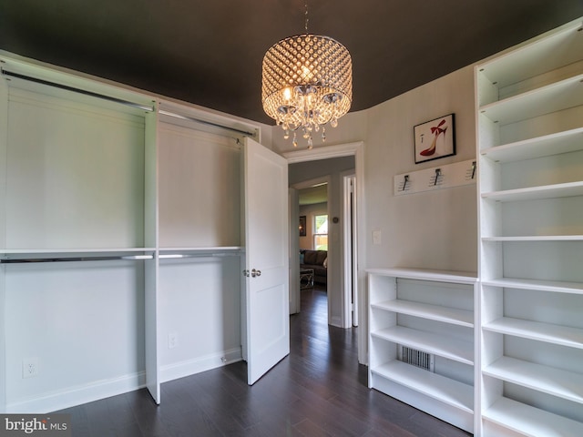 2509 Mason St, Silver Spring, MD 20902 - unfurnished bedroom featuring a chandelier, baseboards, and dark wood-style flooring