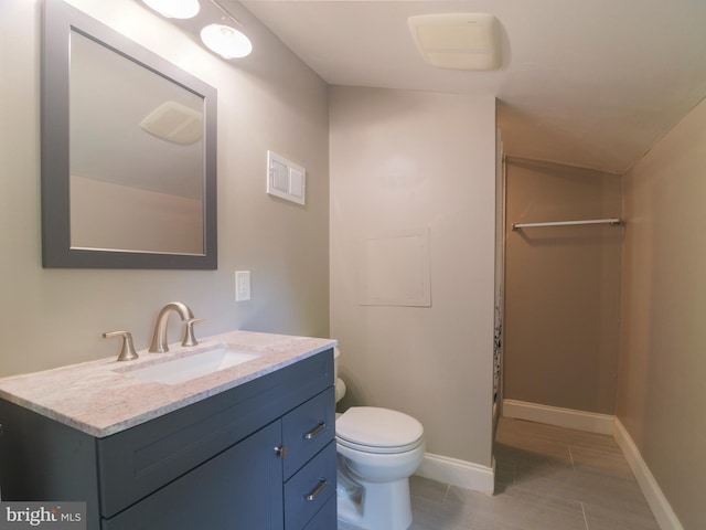 2509 Mason St, Silver Spring, MD 20902 - full bathroom with vanity, toilet, and baseboards