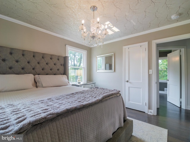 2509 Mason St, Silver Spring, MD 20902 - bedroom with a chandelier, dark wood-type flooring, ornamental molding, and baseboards