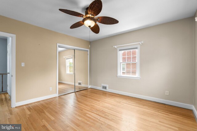 6317 Taylor Rd, Riverdale, MD 20737 - unfurnished bedroom featuring light wood-style floors, a closet, and ceiling fan