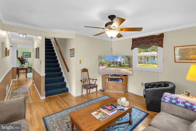 525 Center Dr, Severna Park, MD 21146 - living area featuring wood finished floors, ornamental molding, stairway, and a ceiling fan