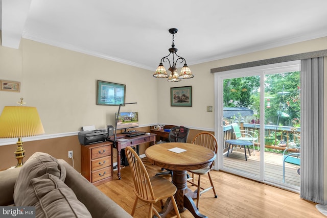525 Center Dr, Severna Park, MD 21146 - dining room featuring light wood finished floors, ornamental molding, a chandelier, and wainscoting