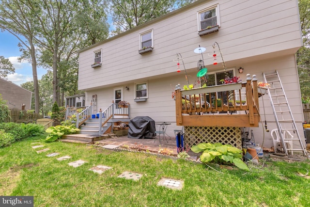 525 Center Dr, Severna Park, MD 21146 - back of property featuring a wooden deck and a lawn