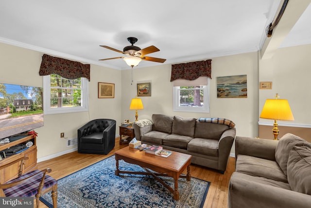 525 Center Dr, Severna Park, MD 21146 - living area with plenty of natural light, wood finished floors, crown molding, and a ceiling fan