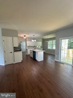 5920 Plata St, Clinton, MD 20735 - unfurnished living room with dark wood-type flooring and baseboards