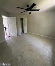 5920 Plata St, Clinton, MD 20735 - unfurnished bedroom with baseboards and a ceiling fan