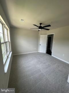 5920 Plata St, Clinton, MD 20735 - empty room with dark carpet and ceiling fan