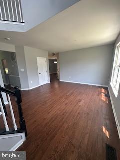 5920 Plata St, Clinton, MD 20735 - unfurnished living room featuring dark wood-style flooring