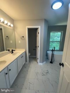 5920 Plata St, Clinton, MD 20735 - full bath featuring marble look tile flooring, double vanity, and a freestanding bath