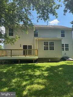 5920 Plata St, Clinton, MD 20735 - rear view of property with a wooden deck and a lawn