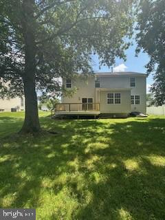 5920 Plata St, Clinton, MD 20735 - back of house featuring a wooden deck and a lawn